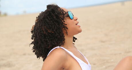 Sexy black dark hair amateur Pixie Minx exhibits her ass at beach